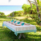 Teal & coral hand block printed cotton tablecloth set for dinner in a beach setting