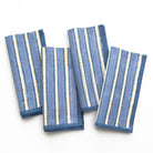 Set of four blue striped napkins on a white background