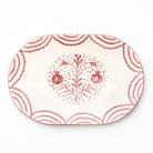 Decorative platter with pink floral design on a white background