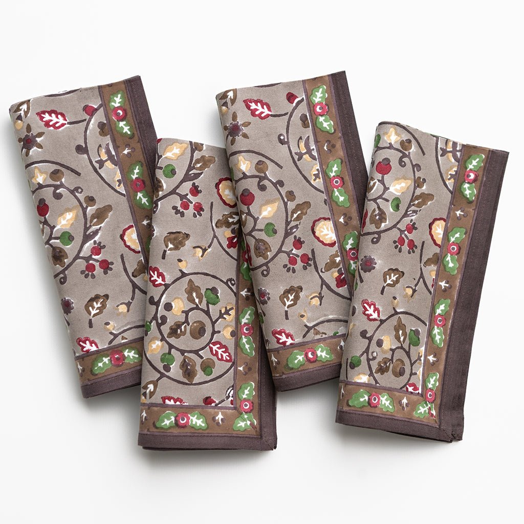 Set of four patterned napkins on a white background