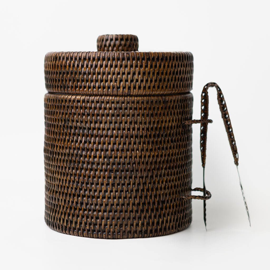 Woven brown basket with a handle on a white background