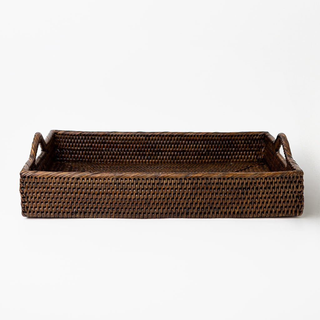 Woven brown tray on a white background