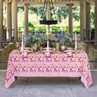 Dining table set with a floral tablecloth in an outdoor setting