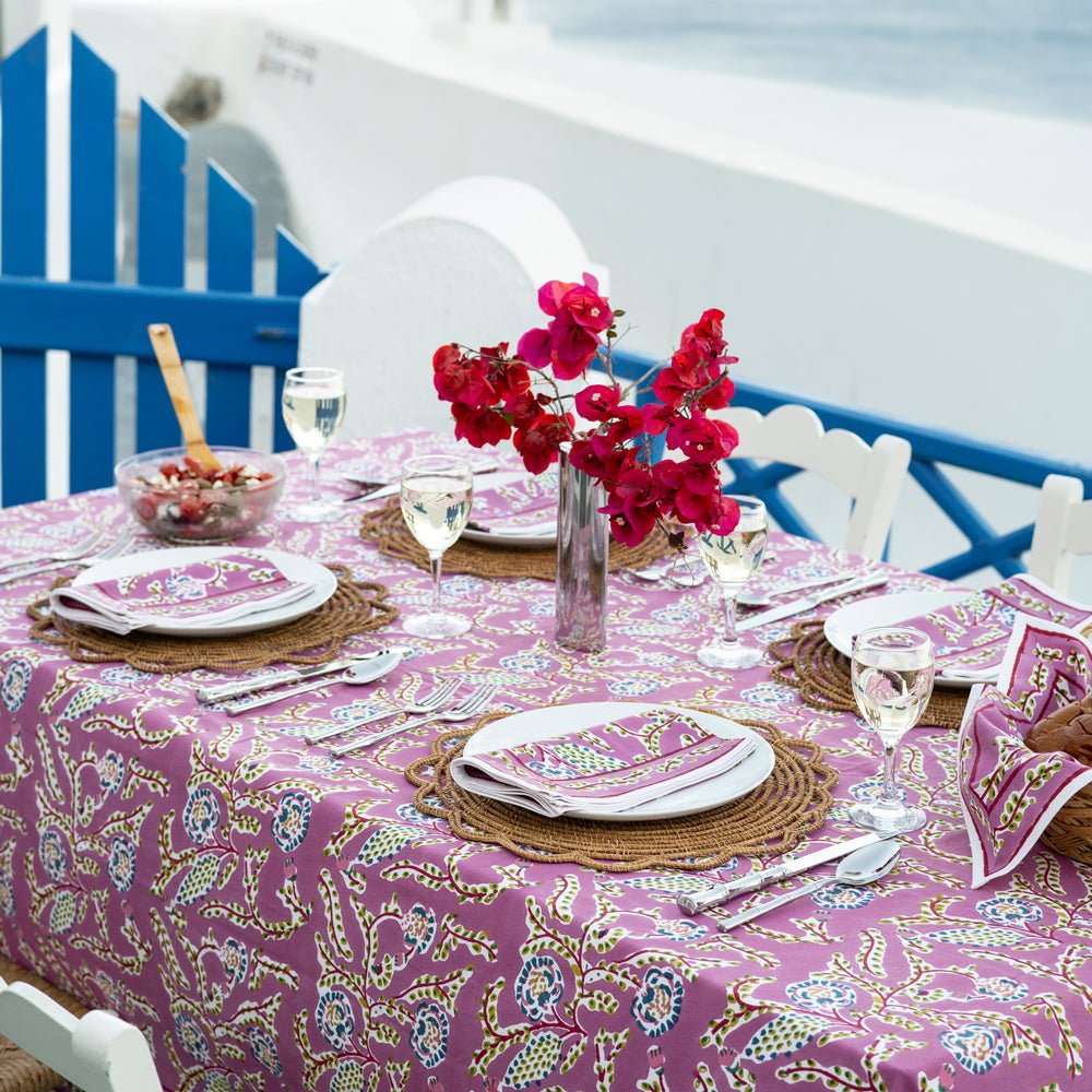 A lilac floral tablecloth and table setting