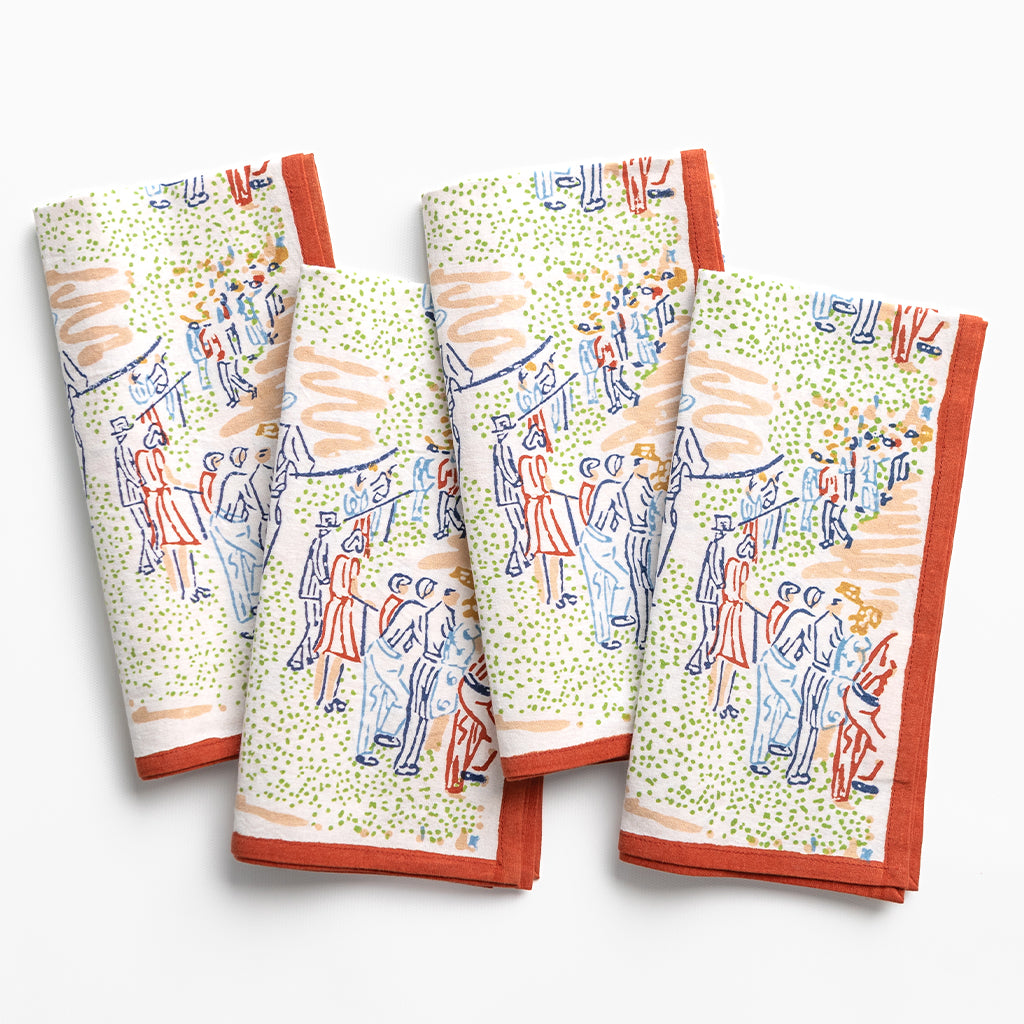 Set of four folded towels with colorful paddock scene hand painted designs on a white background