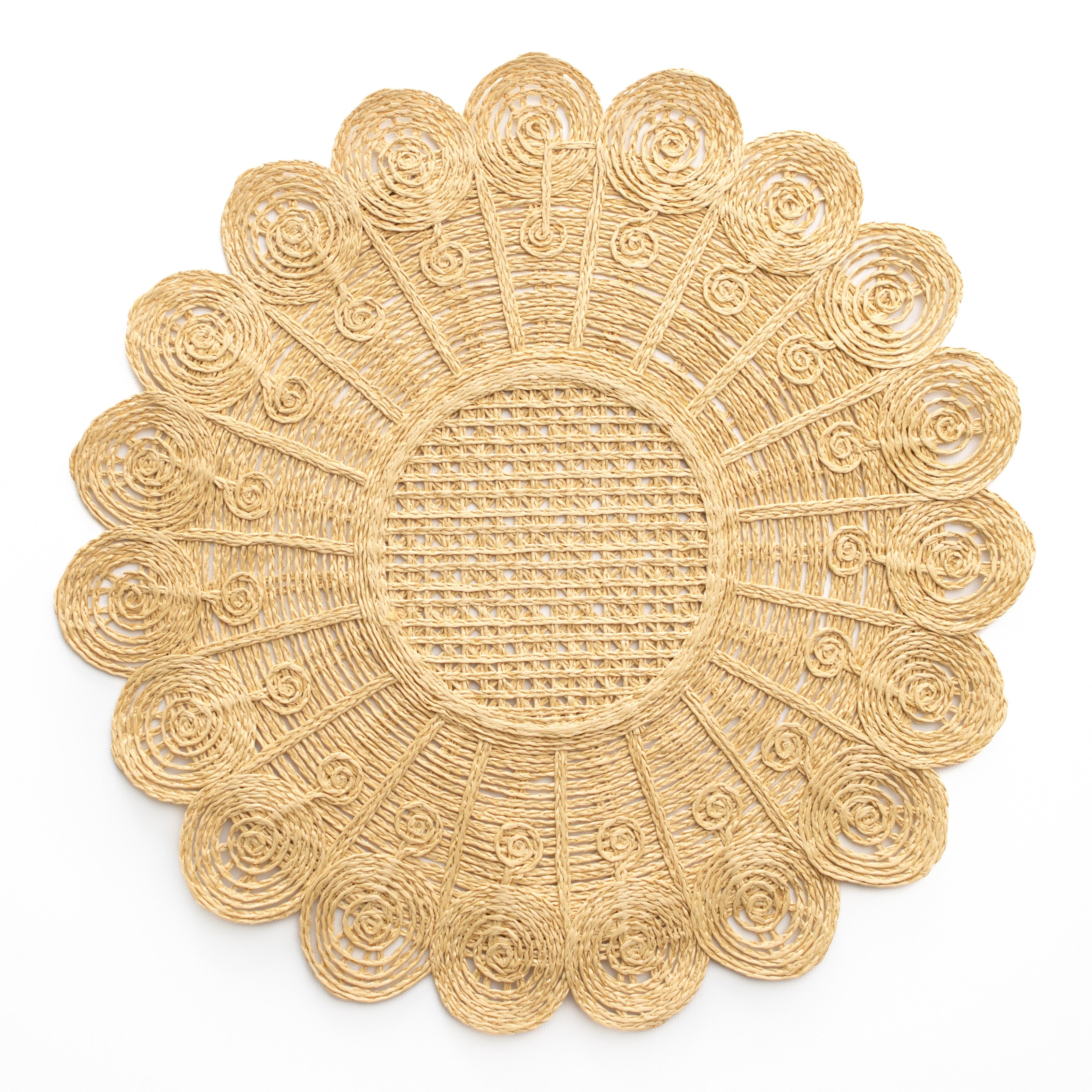 Decorative gold placemat with intricate patterns on a white background