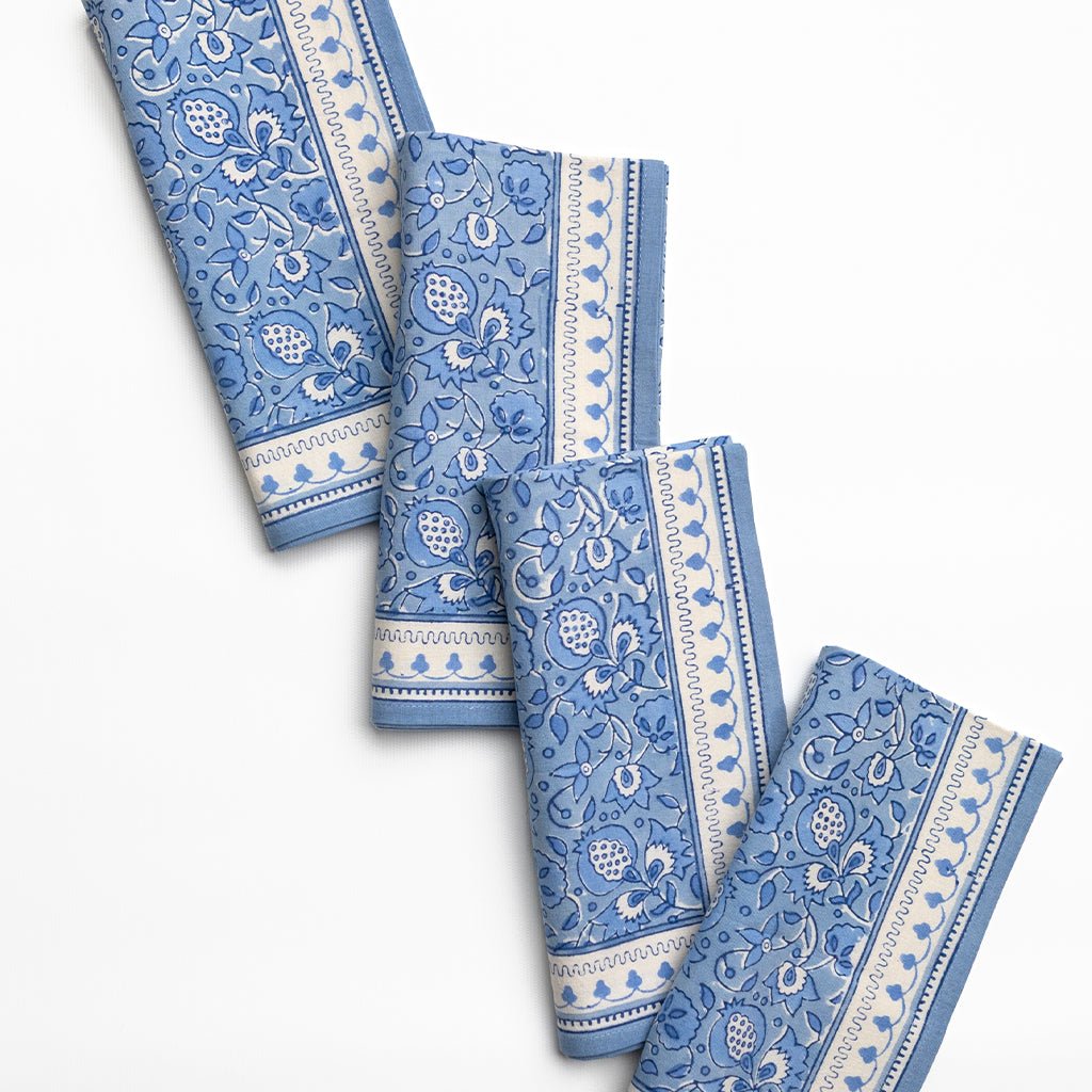 Set of blue patterned towels on a white background