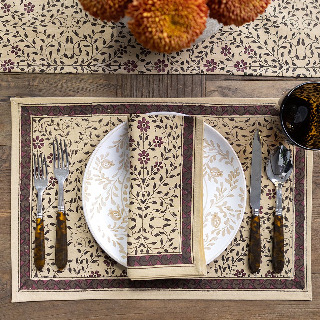 Decorative placemat with floral pattern on a wooden table