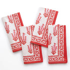 A set of folded Sagar red and white napkins with a hand block-printed design