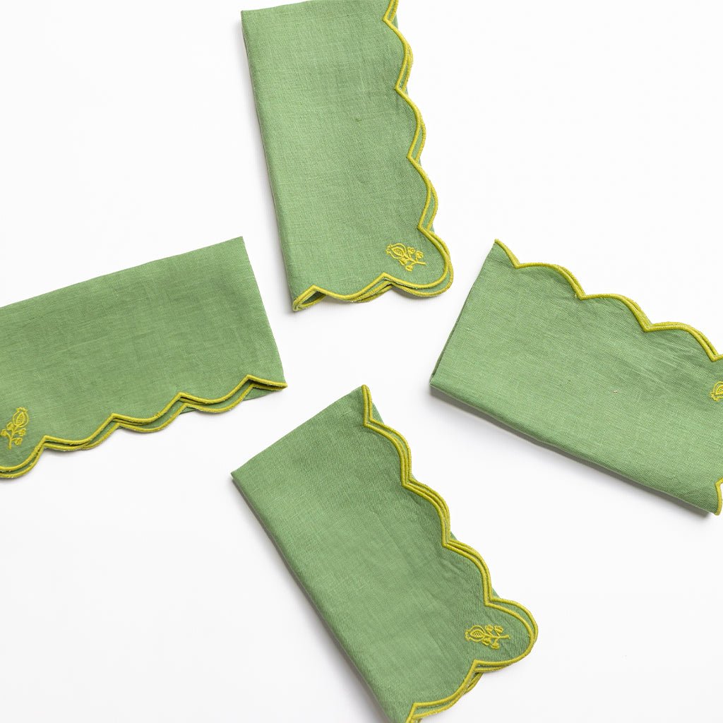 Green napkins with yellow trim on a white background