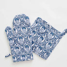 Warm blue hues paired with solid white to give a modern yet global look to this oven mitt set. 