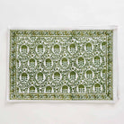 Earthy tones stem from this placemat that consists of green and white intricate details.