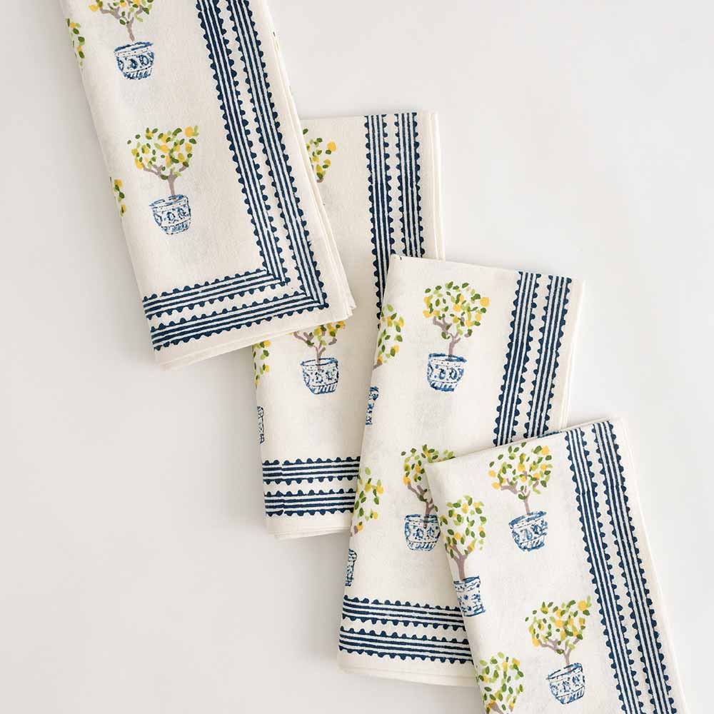 Lemon topiary napkin set of 4 with hues of blue, yellow, and green.