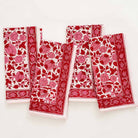 This floral printed pattern of rose, crimson, and bright pink colors, will spice up any table. 