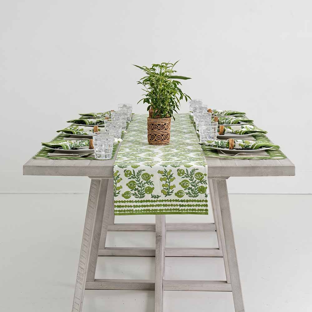 Pom Bells Green table runner down middle of dinner table.