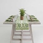 Pom Bells Green table runner down middle of dinner table.