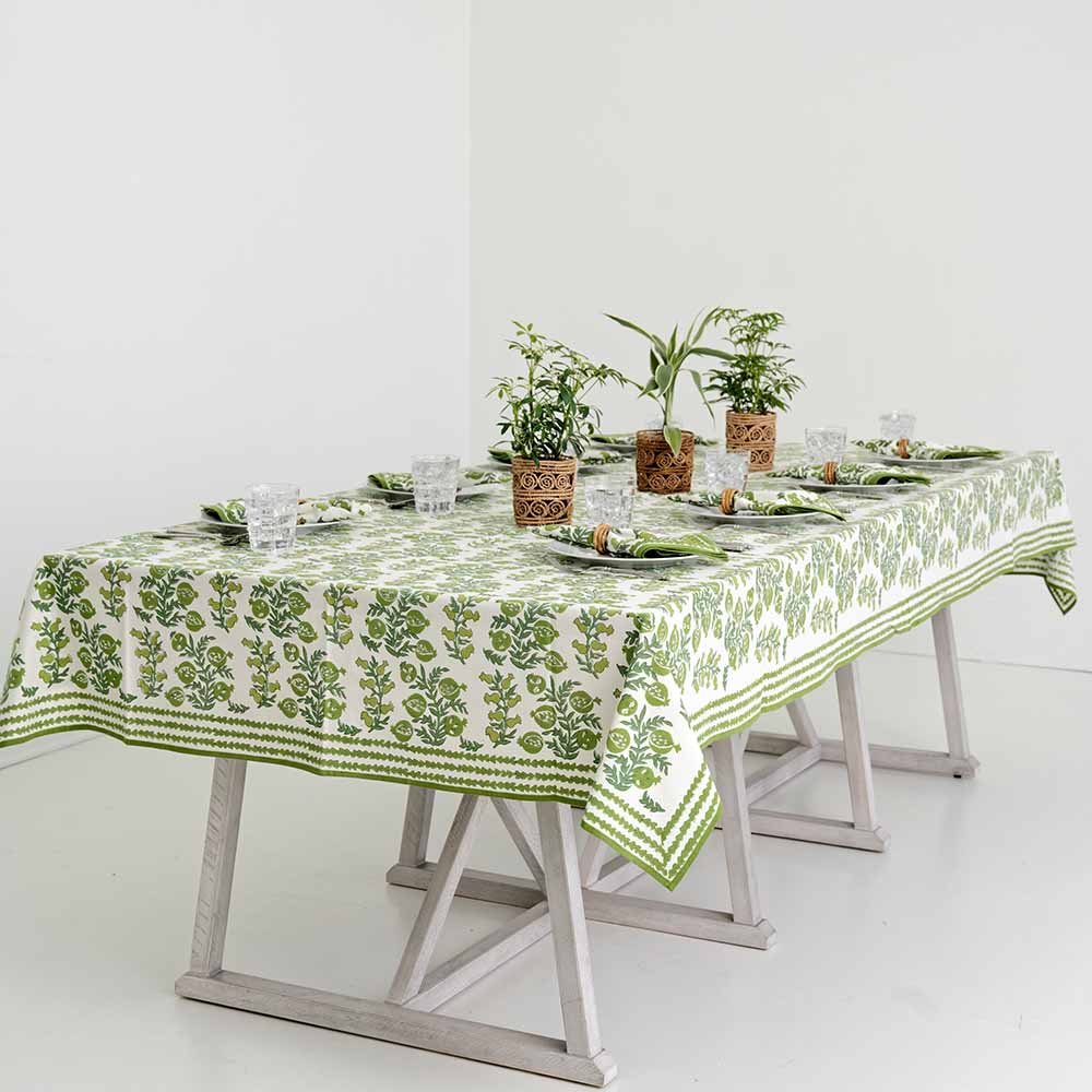 View of dinner table set with Pom Bells Green Tablecloth.
