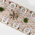 Overhead view of Pom Bells Fern & Poppy tablecloth.