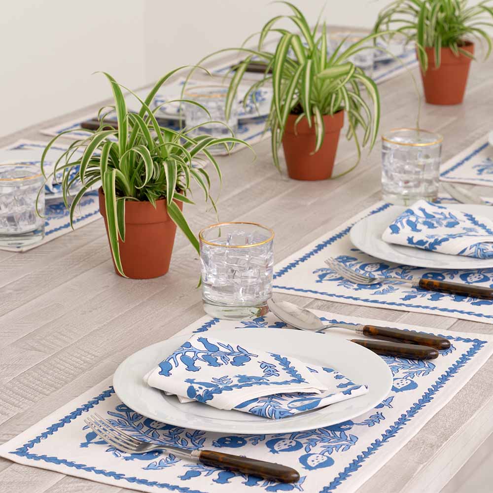 Placemat and napkin folded on a plate. 