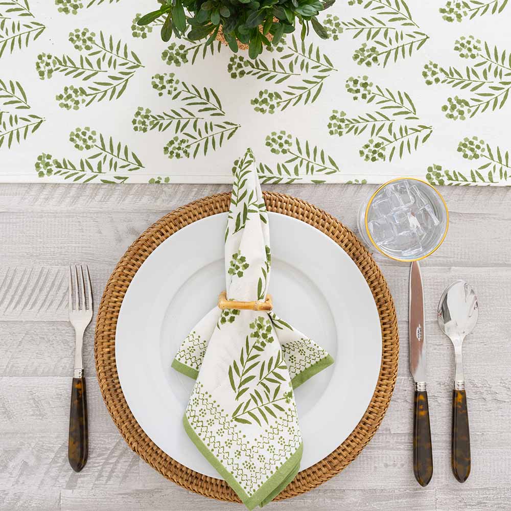 Overhead shot of napkin and matching table runner.