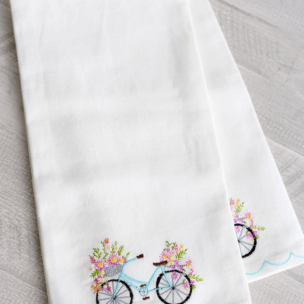 Blossom Bike Tea Towel on white towel