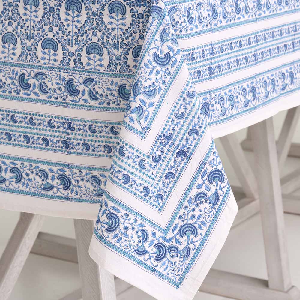 Close up of the blue and white intricate details on the tablecloth.