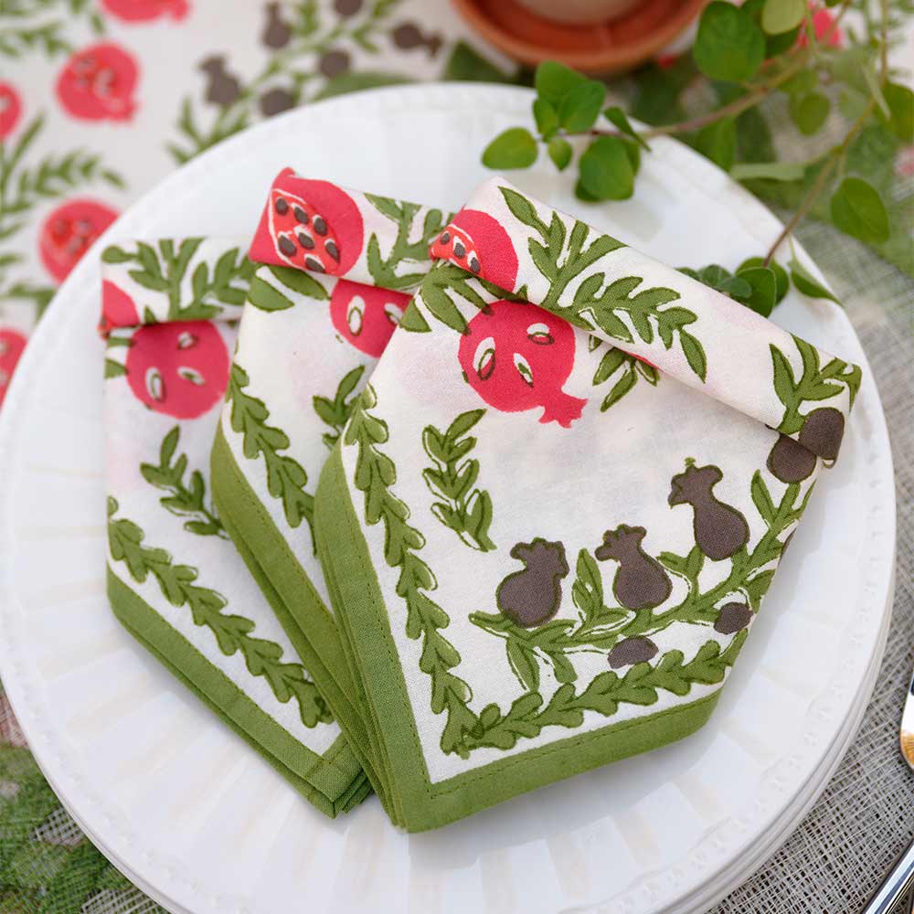 Folded napkins on white plates.