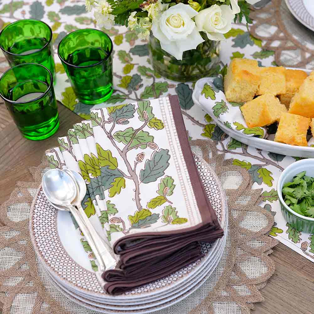 Close up of folded napkins on plates.