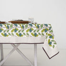 Maple leaf and acorn print tablecloth with brown and white detailed border.