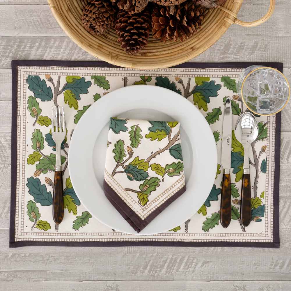 Placemat and matching napkin on white plate.