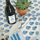 Folded napkins on matching tablecloth.