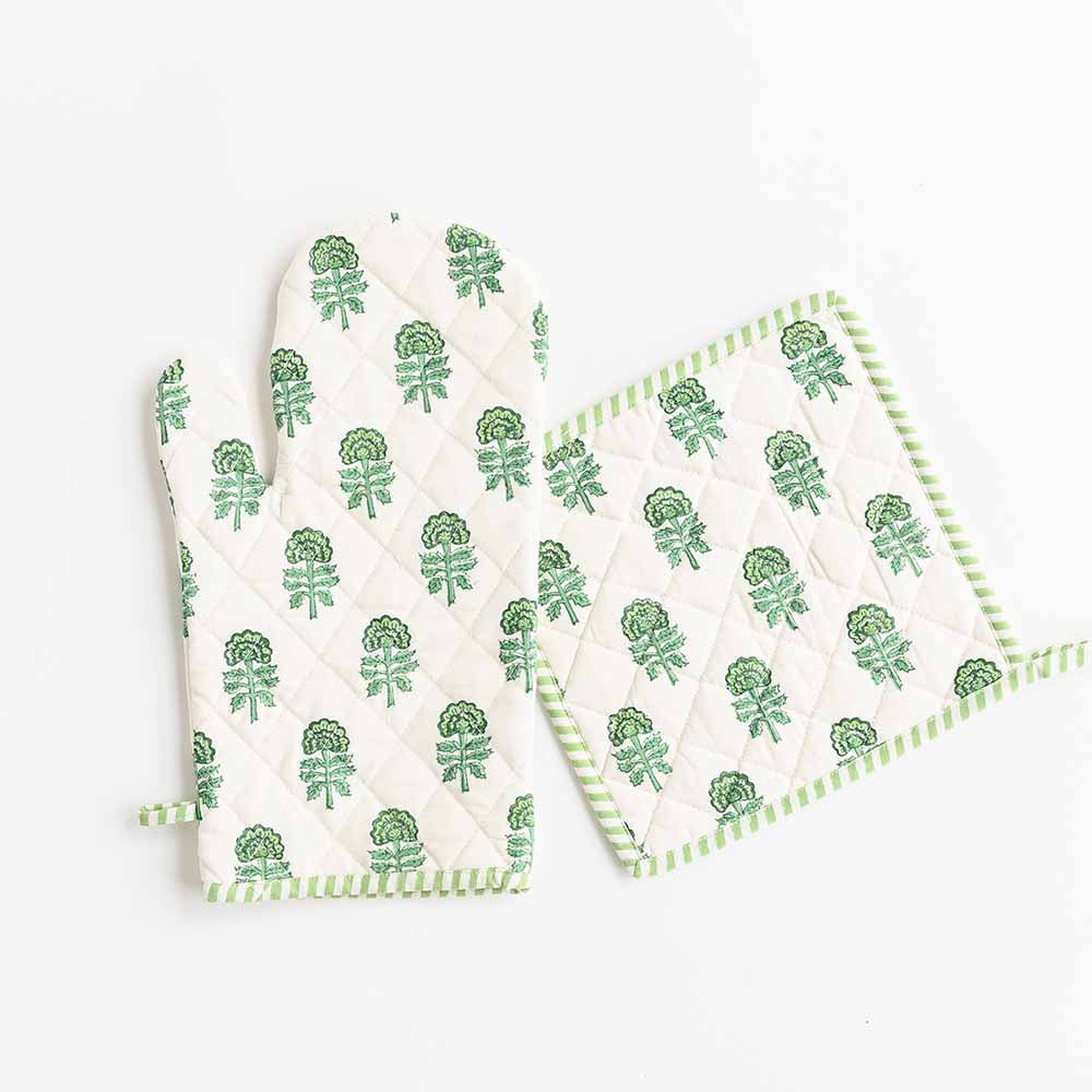 Green and white oven mitt set is edged with striped trim. 