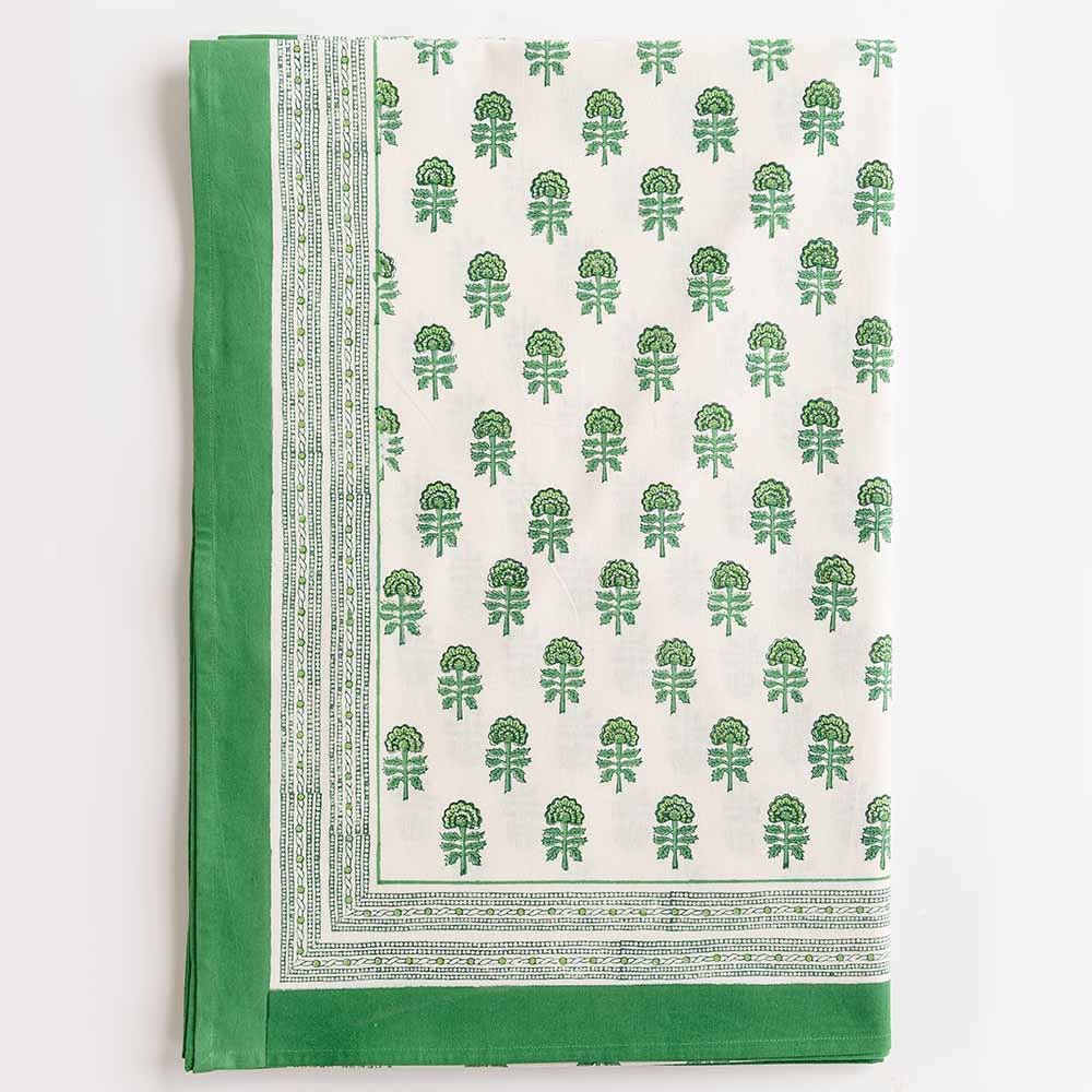 Close up of the floral design outlined with green border.