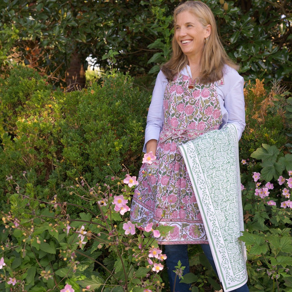 Model wearing Bohemian Floral Moss Green & Mauve Pink apron 