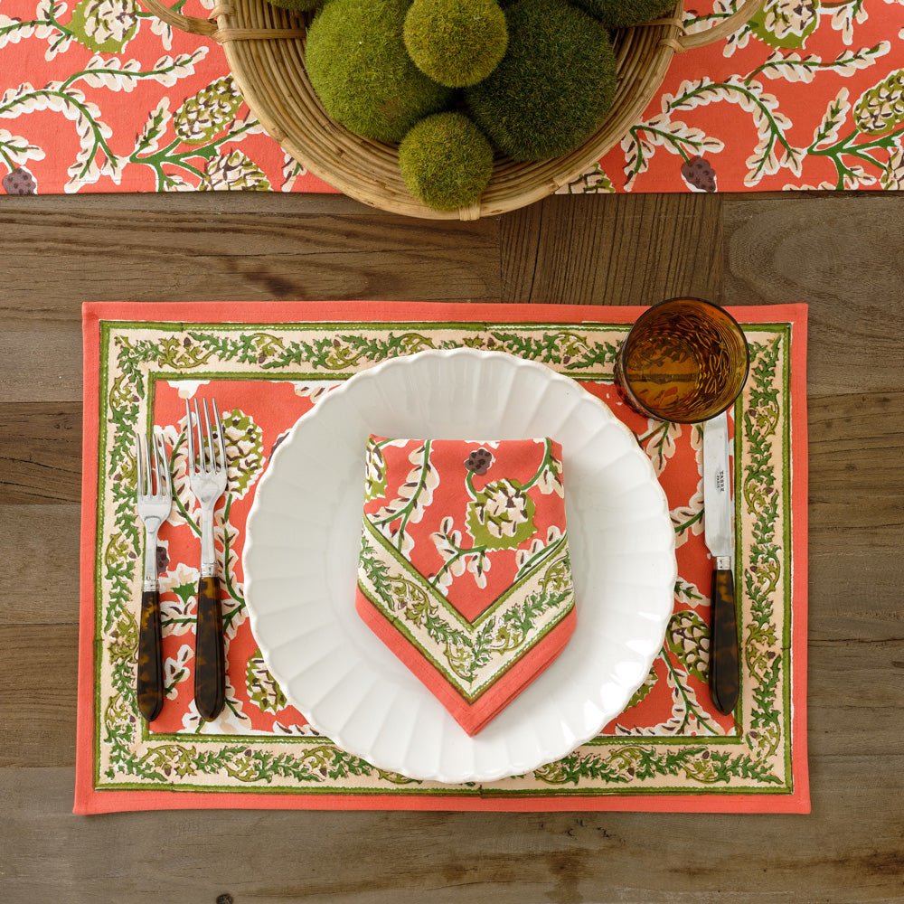Harvest Pinecone orange & green floral napkin on white plate with matching placemat and table runner
