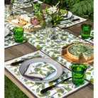 Placemats on dinner table with matching napkins and table runner.