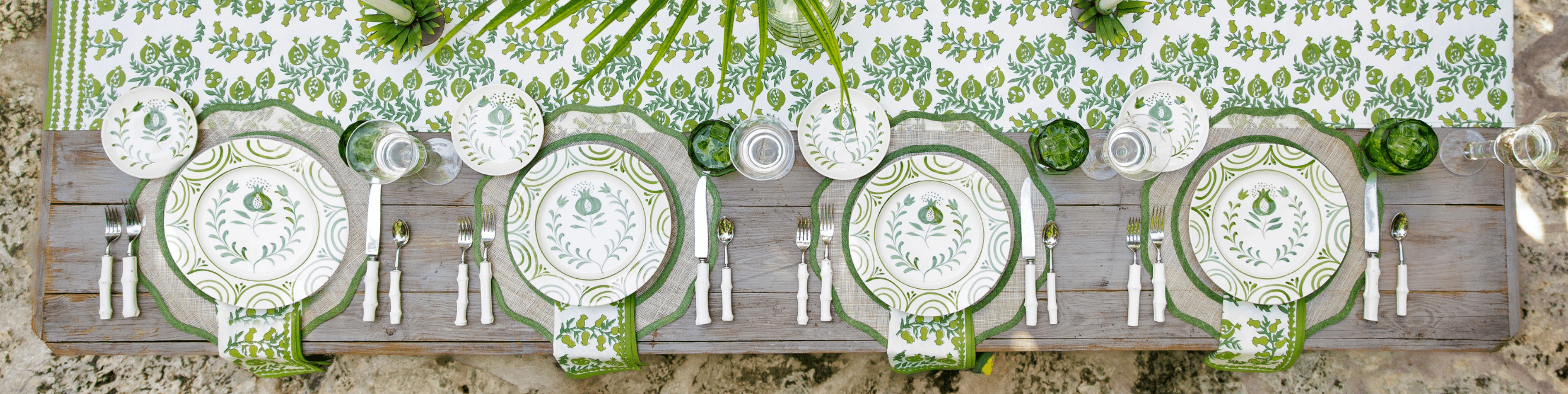 green table runner and ceramic dishes