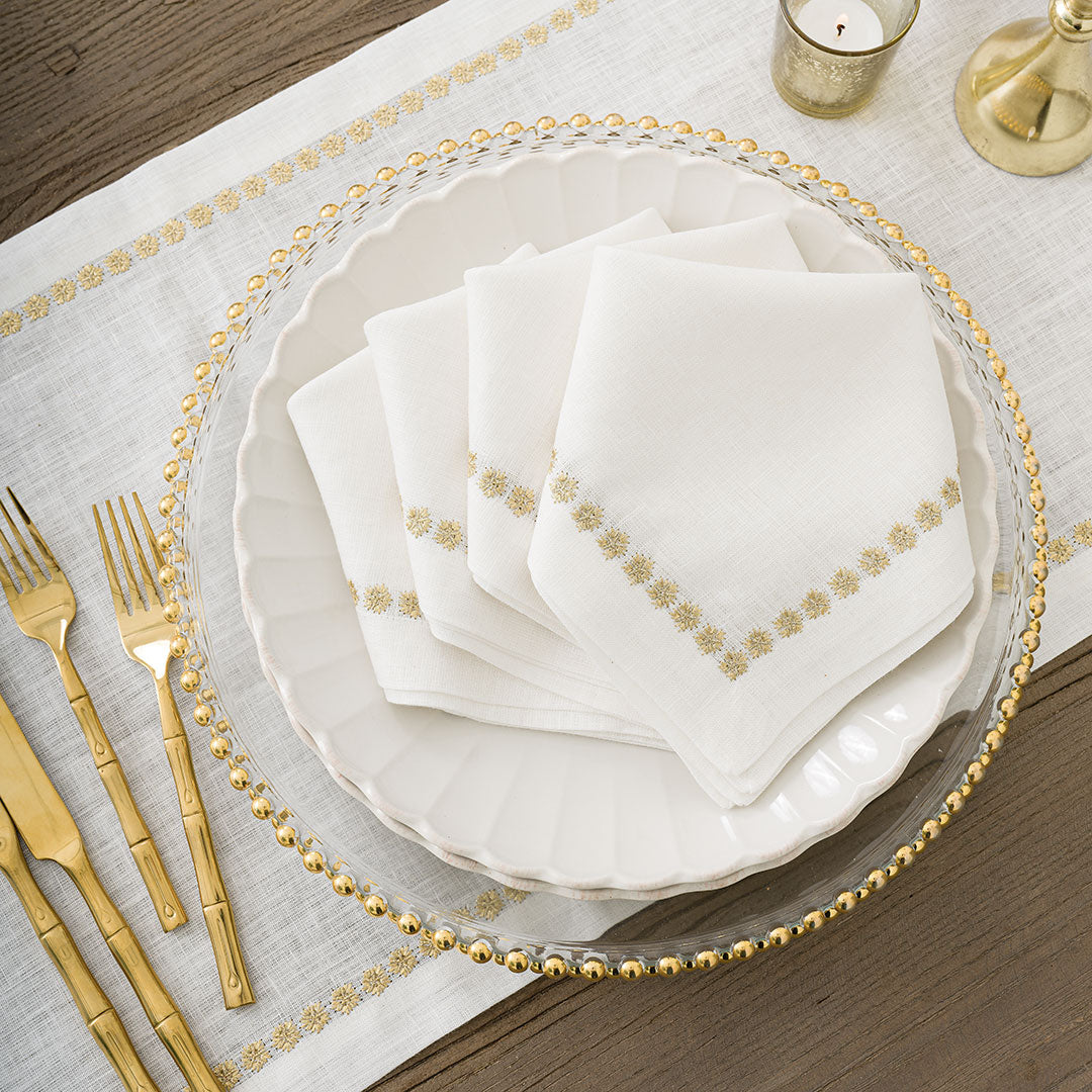 https://pomegranateinc.com/cdn/shop/files/India-Hicks-Gold-Medals-Napkins_7077_2000x.jpg?v=1701226768