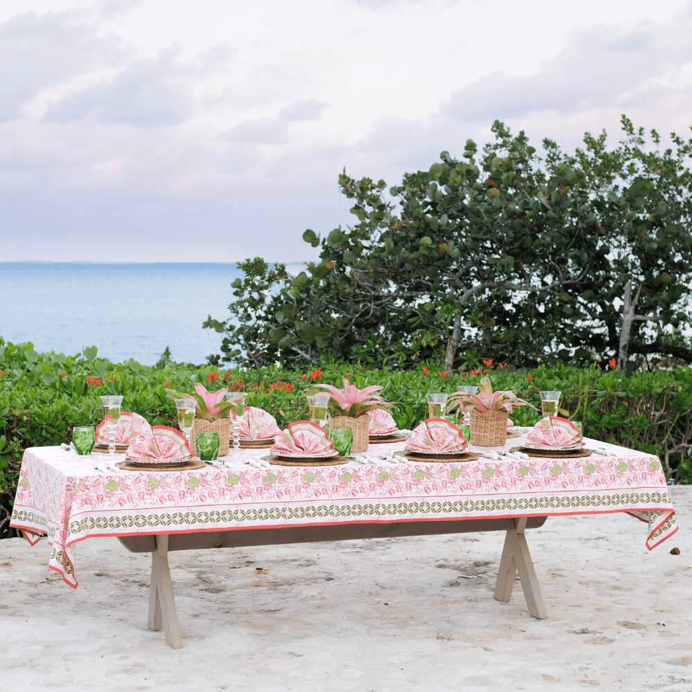Dining table set with a scenic ocean view.