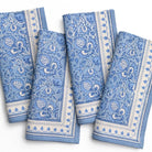 Set of blue and white patterned napkins on a white background