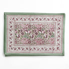 Set of floral patterned placemats on a white background