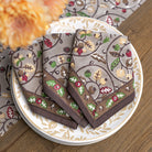 Decorative napkins with floral patterns on a plate