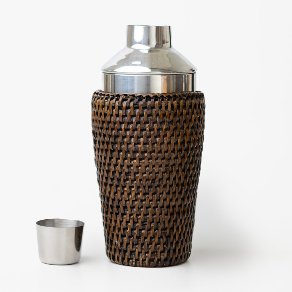 Cocktail shaker with woven design on a white background