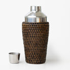 Cocktail shaker with woven design on a white background
