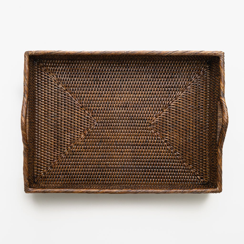 Woven brown tray on a white background