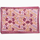 Decorative pink fabric with floral pattern on a white background