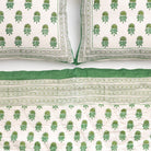 Green and white patterned quilt & pillows