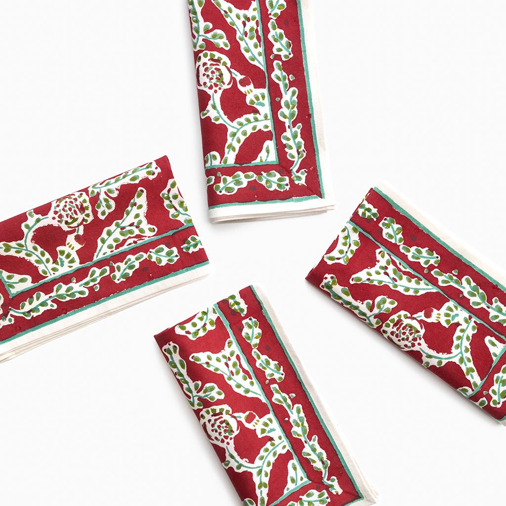 Red and green patterned napkins on a white background