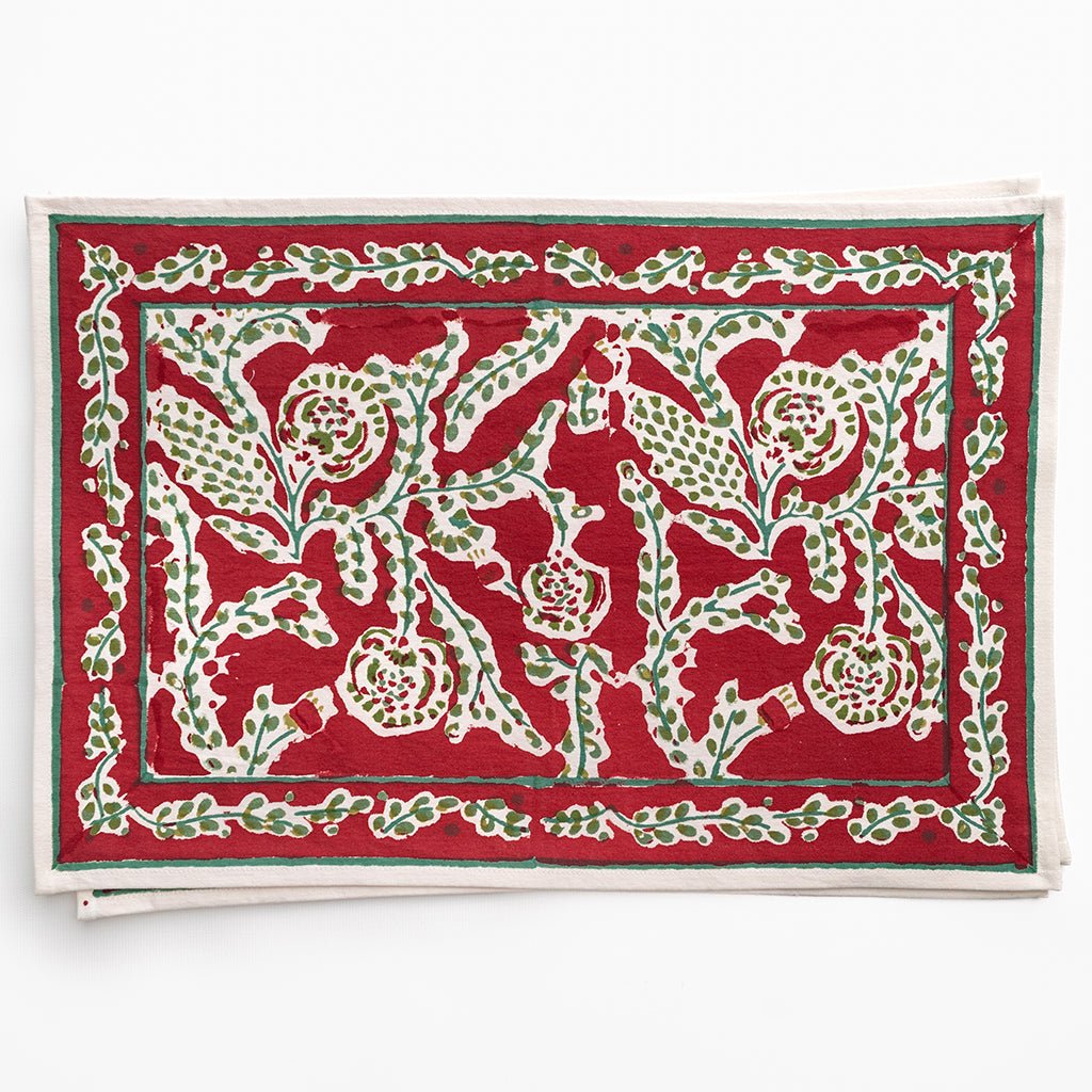 Red card with white floral pattern on a white background