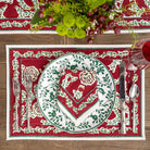 Decorative placemat with a heart design on a red background, featuring cutlery and flowers.